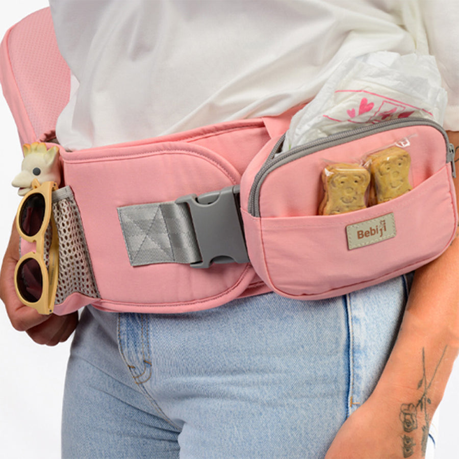 un gros plan sur un porte bébé rose